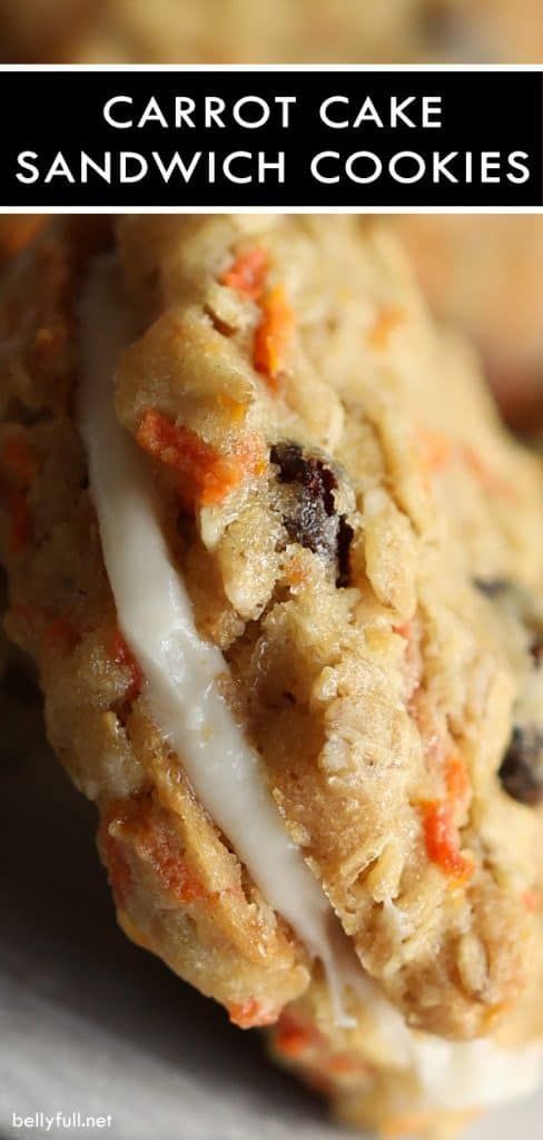 carrot cake sandwich cookies with white icing and raisins on the top one is cut in half