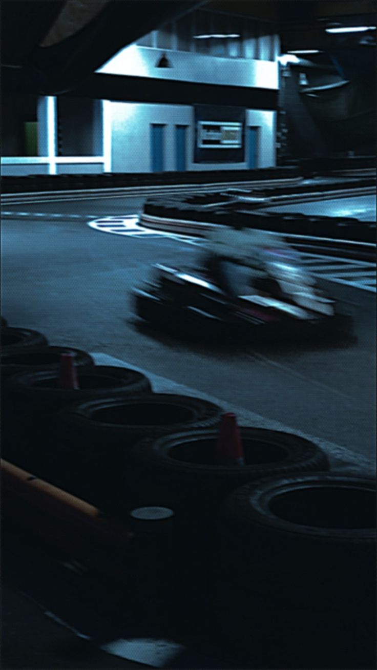 two racing cars in motion on a track