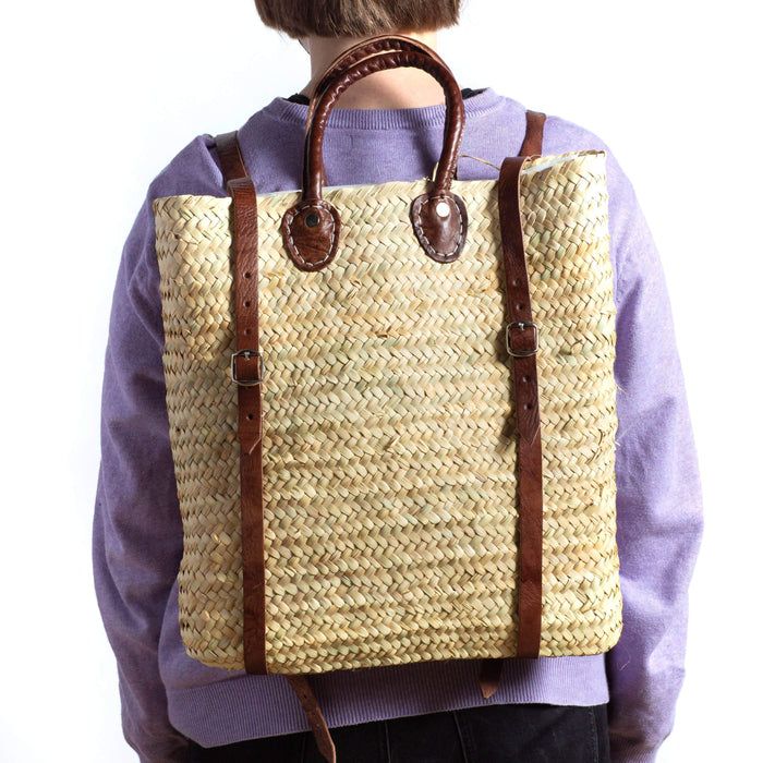 Verve Culture Market Tote Backpack | Milk Street Store Brown Straw Backpack For Travel, Brown Straw Backpack Bag For Travel, Natural Straw Backpack For Travel, Straw Backpack With Braided Handles For Travel, Casual Everyday Straw Backpack, Casual Everyday Straw Backpack Bag, Casual Straw Backpack Bag For Travel, Casual Straw Backpack Bag For Everyday Use, Casual Straw Backpack For Everyday Use