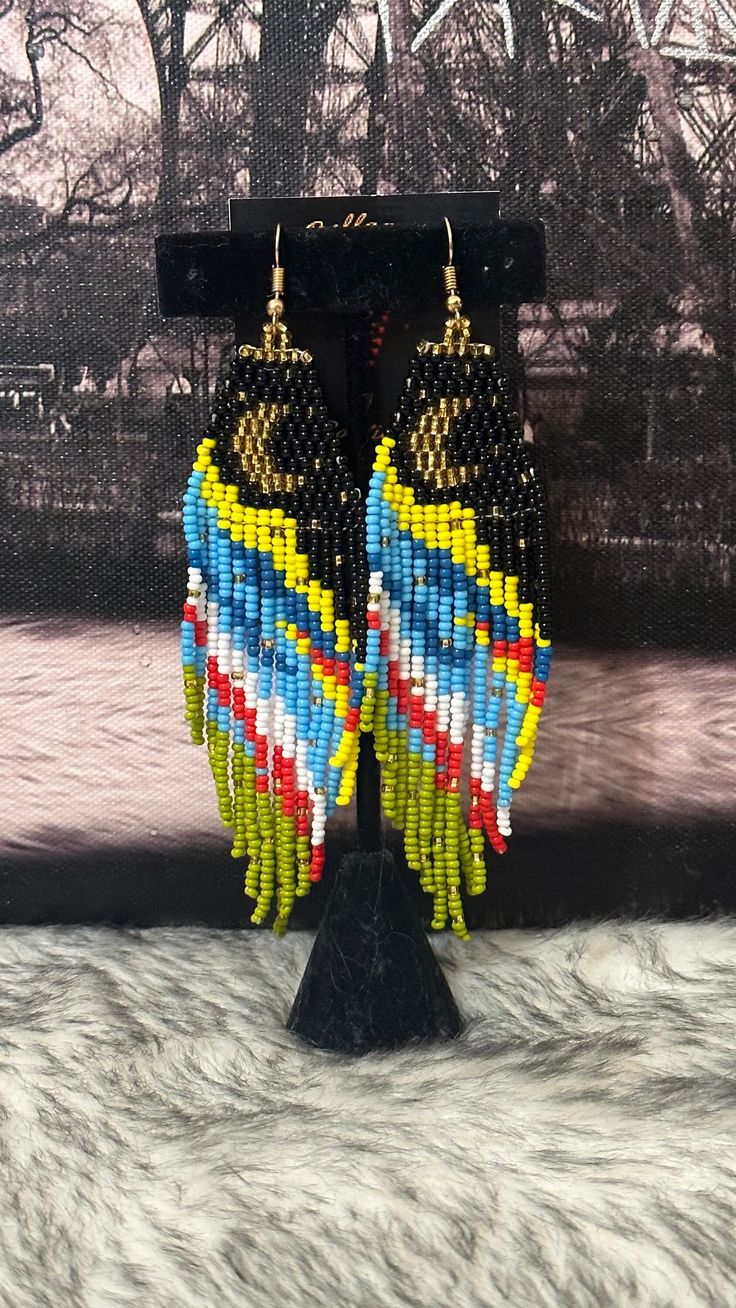 Beautiful long earrings handmade by Mexican artisans. Moon and stars design. Crescent Moon Beaded Earrings, Moon Fringe Earrings, Native American Beadwork Earrings Moon & Milk, Multicolor Bohemian Hand-strung Beaded Earrings, Moon Earrings, Star Designs, Long Earrings, Earrings Handmade, Moon