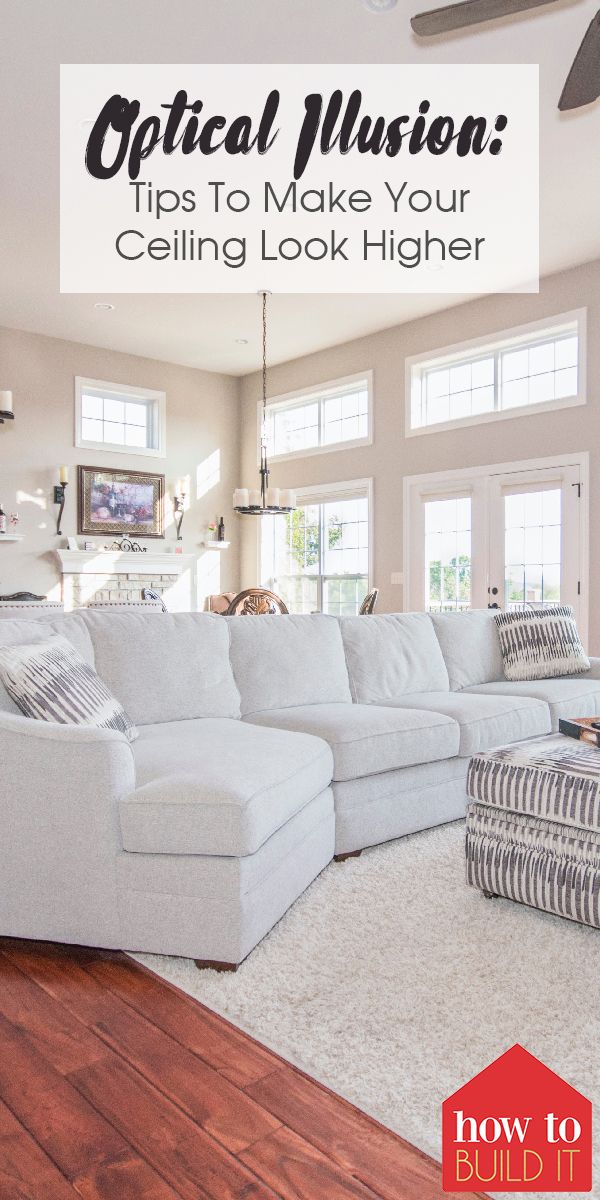 a living room with white furniture and wood flooring, the words optical illusion tips to make your ceiling look higher