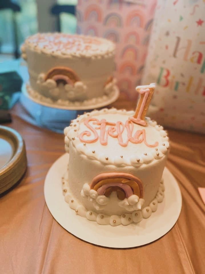 two birthday cakes sitting on top of a table