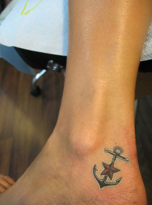 a small anchor and star tattoo on the foot