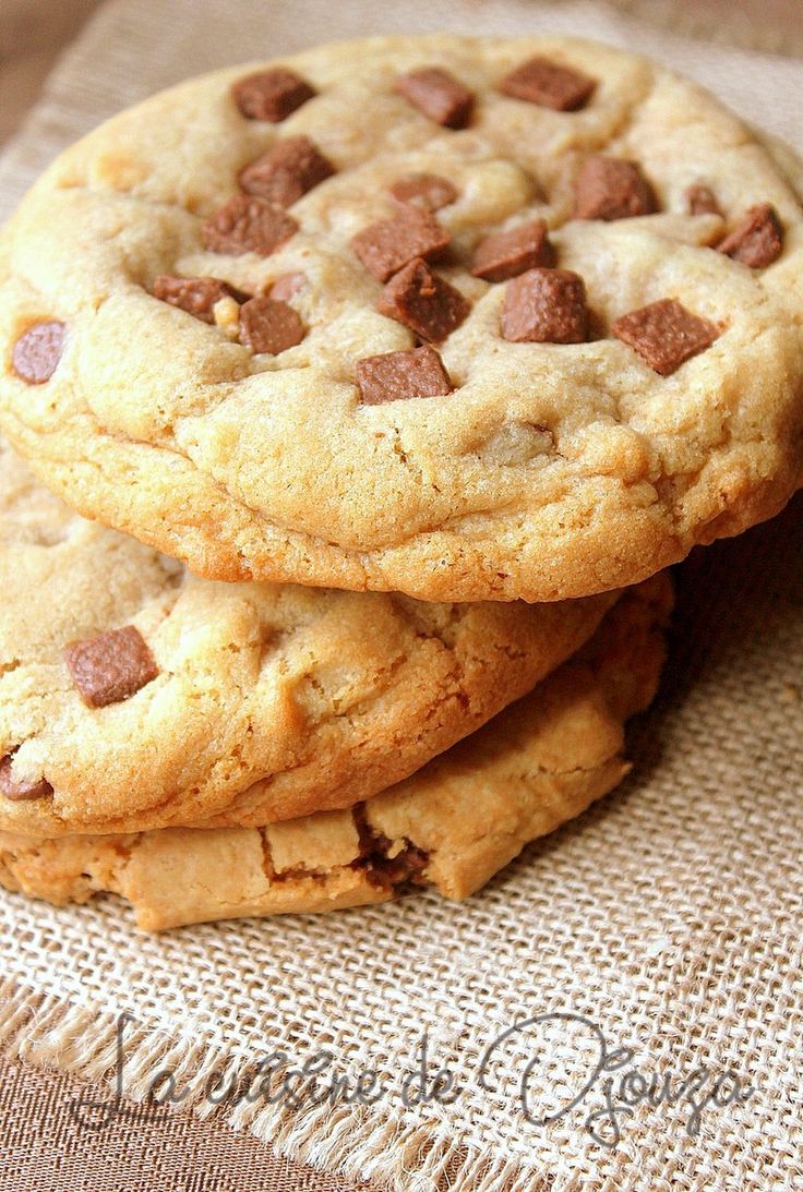 three chocolate chip cookies stacked on top of each other