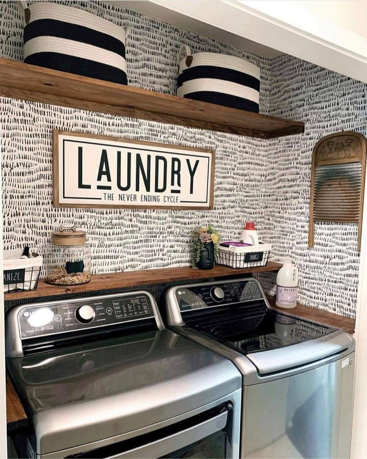 the laundry room is clean and ready to be used as a washer and dryer