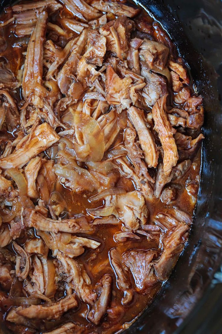 the food is being cooked in the crockpot on the stove top, ready to be eaten