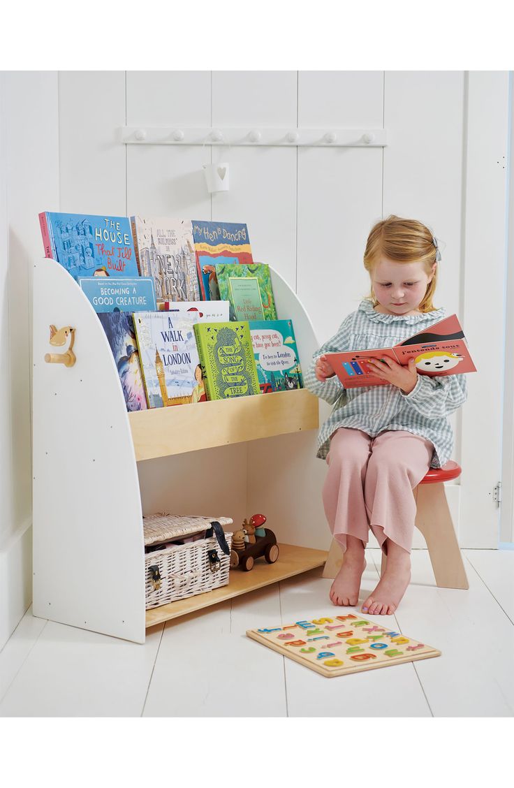 This sturdy and practical bookcase and storage unit features a little wren coat hook on the side. It's perfect for displaying and storing all your little one's colourful picture books and can be affixed to the wall for extra safety. Ages 3 and up 31.89" x 11.61" x 30.39" 24.82 lb. Rubber wood Spot clean Imported Forest Book, Walks In London, Book Week Costume, Wooden Books, Costumes For Sale, Book Case, Picture Books, Coat Hooks, Wren