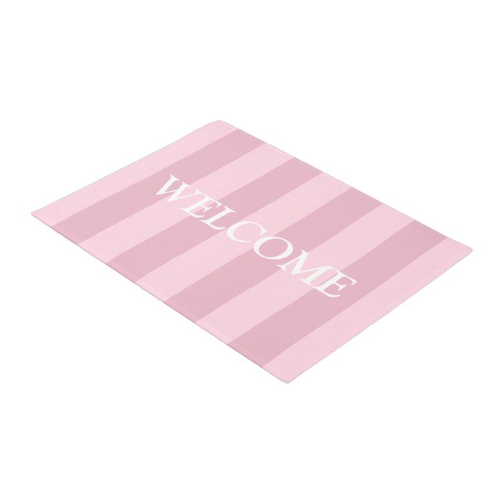 a pink and white welcome mat with the word'welcome'written in white on it