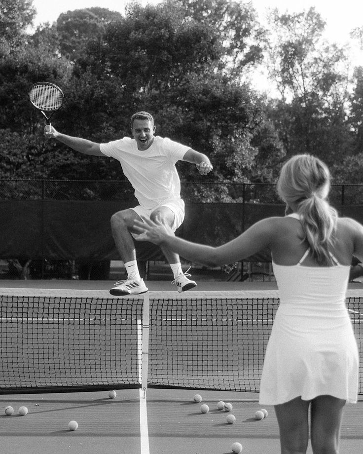 a man and woman playing tennis on a court