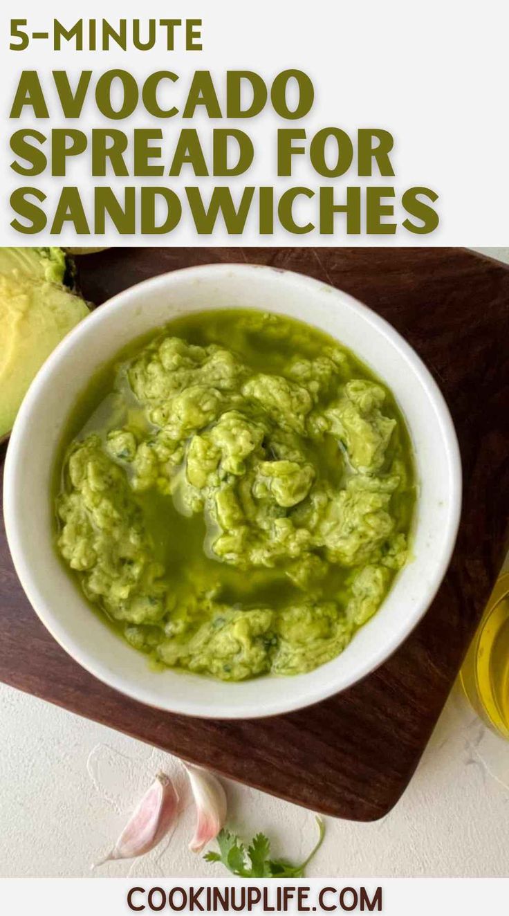 a white bowl filled with guacamole on top of a wooden cutting board