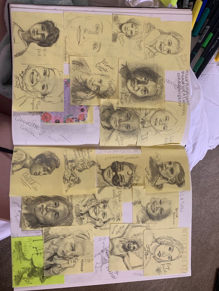 several drawings and pencils on top of a piece of paper with people's faces