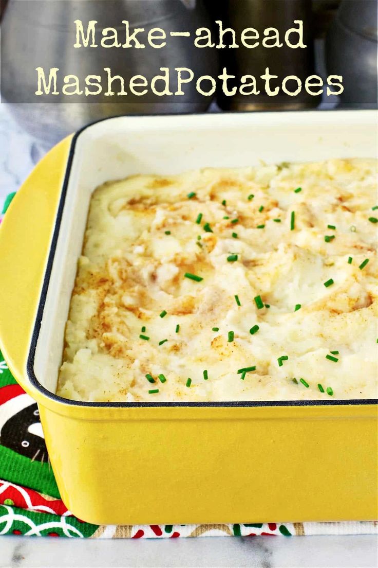 baked mashed potatoes in a yellow casserole dish with green sprinkles