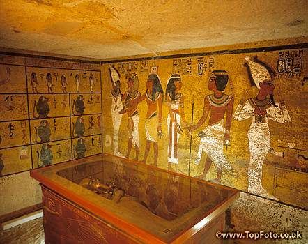 an egyptian room with paintings on the wall