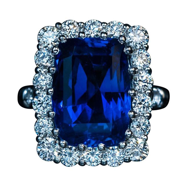 An 11.51 ct old mine cut Ceylon sapphire of a vivid blue color is set in a modern platinum and diamond ring. The diamonds are bright white and clean: F-G color, VS clarity. Total diamond weight is 1.61 ct. The sapphire and diamond cluster measures 19 x 15 mm (11/16 x 9/16 in.) Ring size 7 (17 mm) sizable Weight is 14.55 grams. The ring is accompanied by the AGL Prestige Gemstone Report 1113777 for the sapphire. Round Diamond Setting, Platinum Diamond Rings, Ceylon Sapphire, Jewels Rings, Golden Ring, Sapphire Diamond Ring, Minerals And Gemstones, Platinum Ring, Sapphire Jewelry