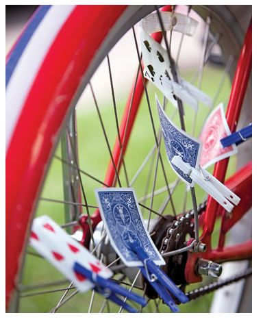 red, white and blue bicycle wheels with stickers on them