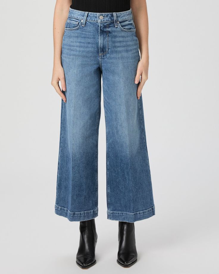 This high rise, extra wide leg has a cropped, ankle length silhouette. This pair is crafted in PAIGE VINTAGE denim with a portion of organic cotton and comes in a light/medium wash with lived-in details. PAIGE VINTAGE takes all the work out of breaking in your favorite pair of vintage jeans. We've combined the comfort of stretch with everything you love about authentic vintage denim to create super soft jeans that feel perfectly lived-in from the very first wear. Eco-positive methods and modern Medium Wash Wide-leg Cropped Jeans With Five Pockets, Medium Wash Wide Leg Cropped Jeans For Fall, Fall Medium Wash Wide Leg Cropped Jeans, Wide Leg Medium Wash Cropped Jeans For Fall, Fall Wide Leg Cropped Jeans In Medium Wash, Fall Medium Wash Cropped Wide Leg Pants, Fall Cropped Wide Leg Pants In Medium Wash, Relaxed Fit Medium Wash Wide-leg Cropped Jeans, Relaxed Fit Wide-leg Cropped Jeans In Medium Wash