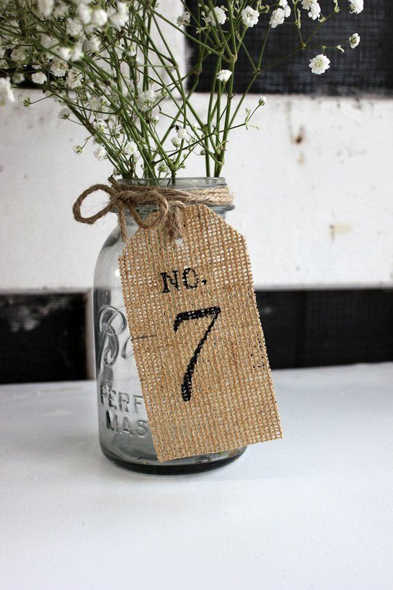 a mason jar filled with baby's breath flowers