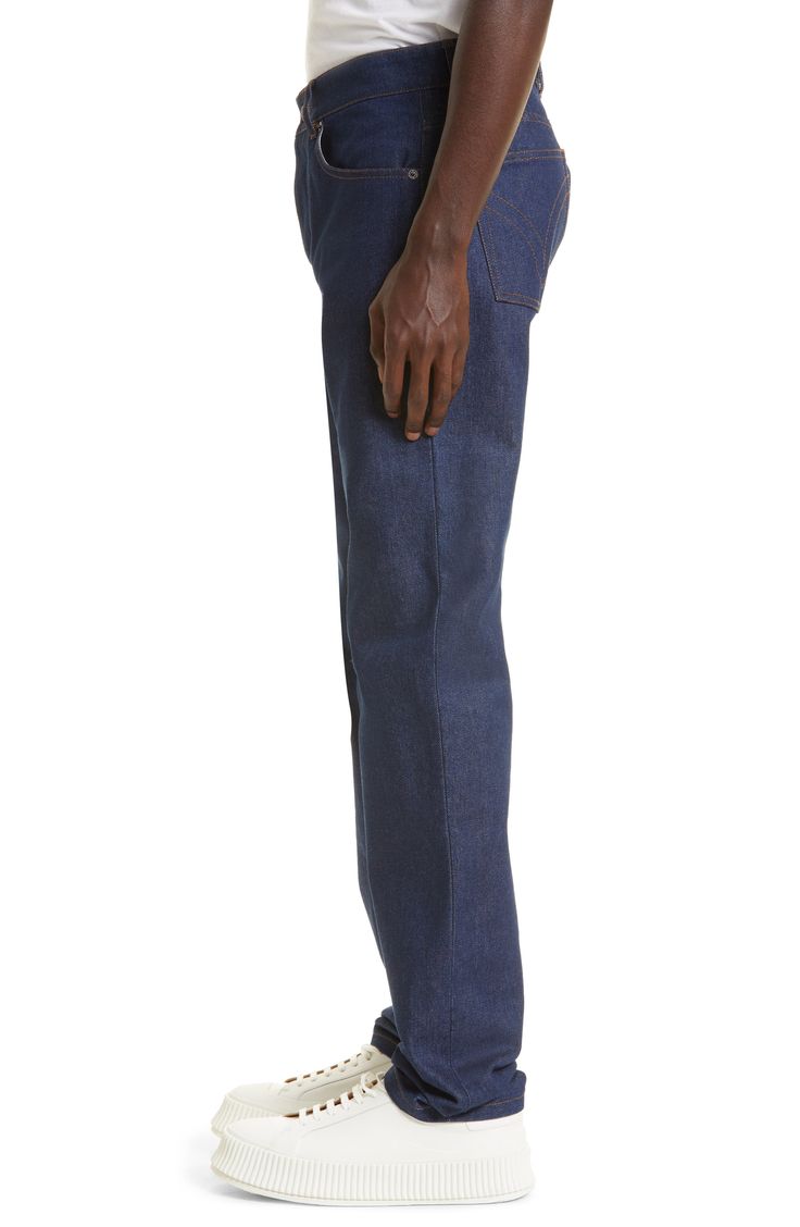 With a classic fit and straight-leg silhouette, these indigo jeans radiate polished appeal that's accented by strategic topstitching. Zip fly with button closure Five-pocket style 100% cotton Dry clean Made in Portugal New Concepts @Nordstrom Classic Straight Leg Jeans With Contrast Stitching, Classic Relaxed Fit Jeans With Contrast Stitching, Classic Jeans With Contrast Stitching, Classic Jeans With Contrast Stitching For Work, Classic Medium Wash Jeans With Contrast Stitching, Classic Jeans With Contrast Stitching And Tapered Leg, Classic Fitted Jeans With Contrast Stitching, Indigo Straight Leg Jeans With Welt Pockets, Classic Denim Pants With Contrast Stitching