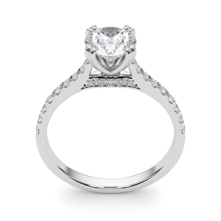 This elegant ring features 1/5 ctw. of dazzling diamonds that extend down the band. A 1.0 - 1.0 ct. round shape stone can be set with this ring.This ring can be customized for other stone sizes or shapes. Please contact us for assistance. Moissanite Diamond Ring With Diamond Accents, Moissanite Round Cut Diamond Ring With Accents, Moissanite Diamond Ring With Diamond Accents Round Cut, Round Cut Diamond Promise Ring, Diamond Ring With Prong Setting And Round Band, Moissanite Diamond Ring With Pave Setting For Promise, Diamond White Single Cut Diamond Wedding Ring For Proposal, Lab Grown Diamond Wedding Ring With Pave Setting, Classic Rings With Single Cut Diamonds For Proposal