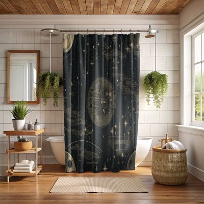 a bathroom with a shower curtain and rug