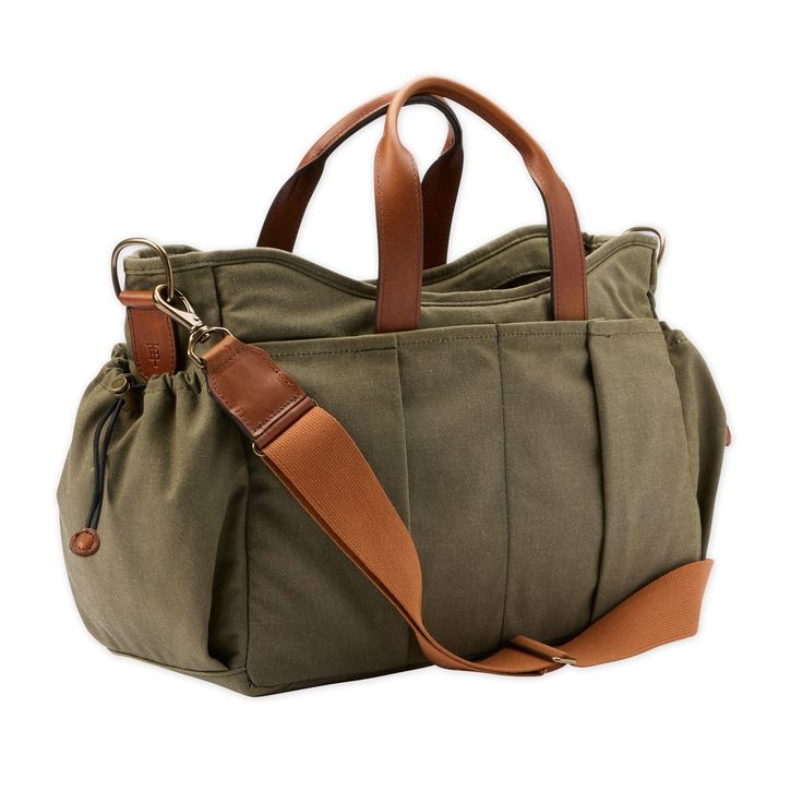 Tom Beckbe is known for heartily designed apparel that can go the distance. Tradition guides the time-tested gear and rugged materials of the brand’s jackets, bags, and accessories, which are built to withstand the elements. A variation on the brand’s Canvas Utility Bag, the Canvas Tailgater Bag features removable interior dividers to carry an assortment of refreshments. Midsized and crafted in durable waxed cotton canvas, this handy utility bag with pockets can serve as a gear organizer, overni Luxury Coated Canvas Bag With Multiple Compartments, Luxury Coated Canvas Box Bag With Detachable Handle, Luxury Outdoor Bag, Luxury Outdoor Bags, Luxury Versatile Bags For Outdoor, Functional Duffle Shoulder Bag With Pockets, Functional Shoulder Duffle Bag With Pockets, Khaki Shoulder Bag With Multiple Pockets For Outdoor, Functional Travel Satchel With Multiple Pockets