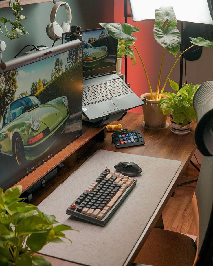 a laptop computer sitting on top of a wooden desk next to a keyboard and mouse