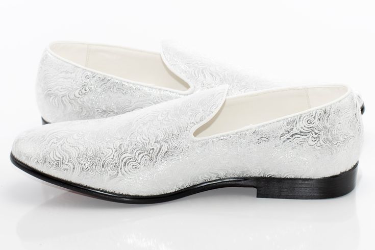 Steal glances in this smooth fitting, metallic styled loafer featuring an ornate embossed upper set atop a patent-black outsole, exuding a clean-cut, luxurious style for formal outfits. Formal Wingtip Slip-ons For Spring, Elegant Formal Slip-ons With Textured Sole, Elegant White Loafers With Textured Sole, Formal Slip-on Wedding Shoes For Spring, Spring Formal Wedding Shoes Slip-on, Spring Formal Wedding Slip-on Shoes, Formal Spring Wedding Slip-on Shoes, Elegant White Slip-ons With Textured Sole, Elegant White Wingtip Loafers