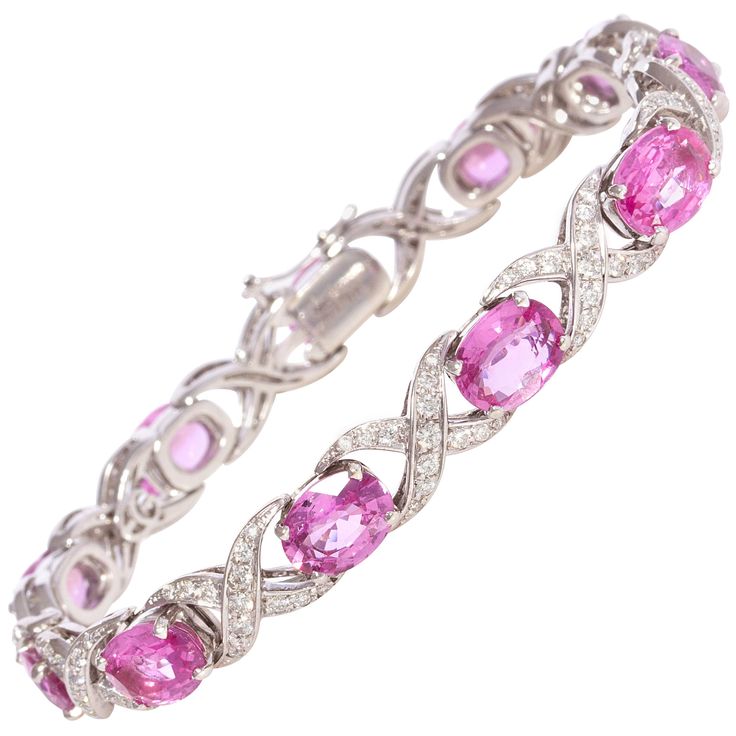 The pink sapphire and diamond bracelet features oval cut faceted sapphires of brilliant hues and crystalline texture for a total of approximately 14 carats. The design is complete with 2.00 carats of top quality diamonds (F/VVS). The bracelet was handmade by gran maestro Pasquale in 18 carat white gold in our own workshop in Italy, according to an original design by Ella Gafter. The item is one-of-a-kind and signed EG. It is shown with 2 more bracelets of the same design in the last image of the Cedric Charlier, Flexible Bracelet, Diamond Bracelet Design, Bracelets Design, Antique Bracelets, Colored Stones, Expensive Jewelry, Sapphire Bracelet, Brown Diamond