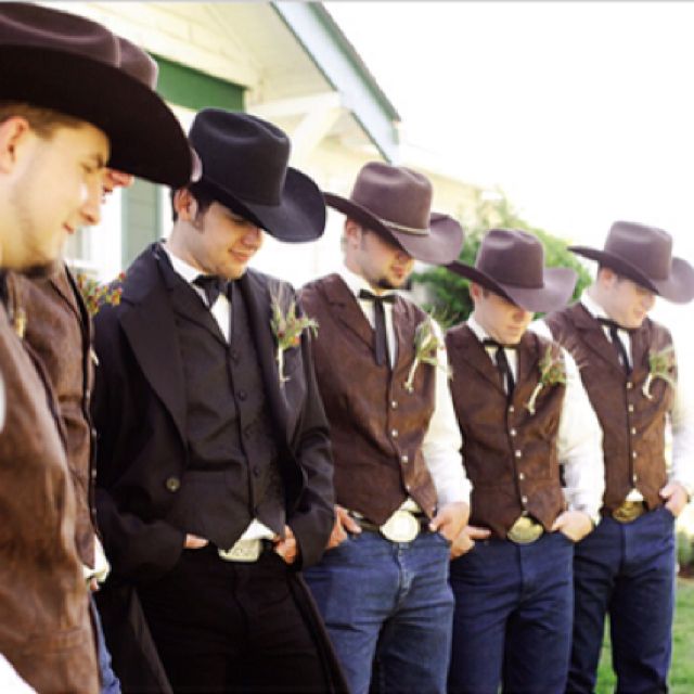 a group of men wearing cowboy hats standing next to each other