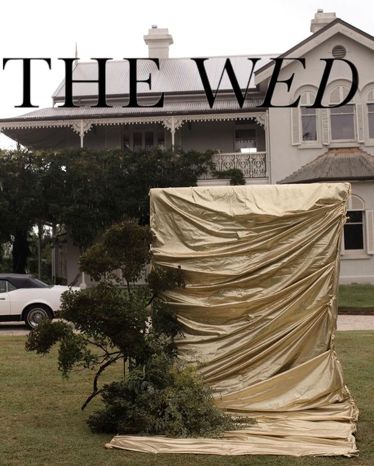 the cover is covering a tree in front of a house