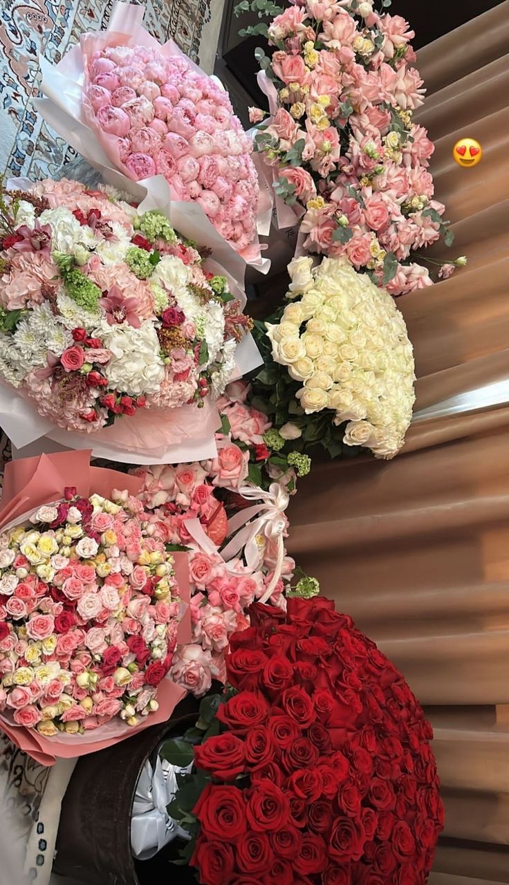 a bunch of flowers that are sitting on a table