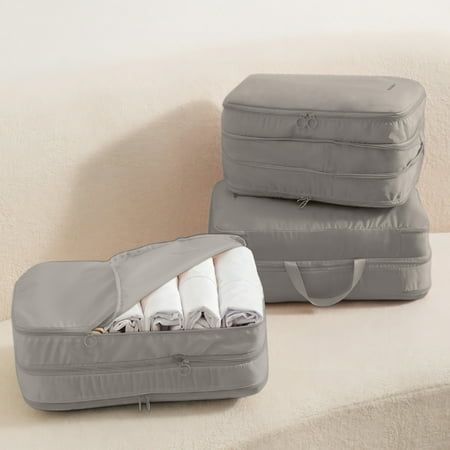 two pieces of luggage sitting on top of a couch