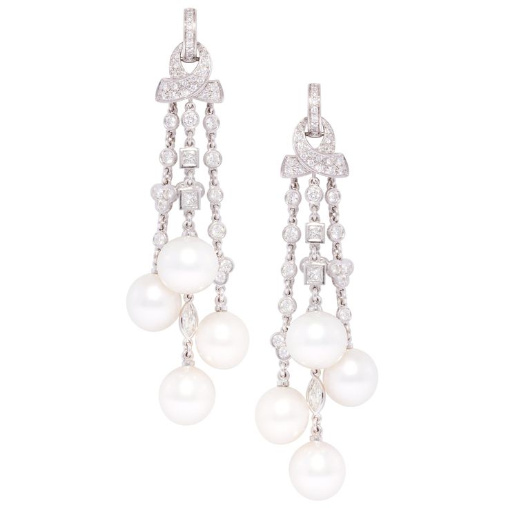 The diamond and pearl chandelier earrings feature a cascade with 8 South Sea pearls of 11mm diameter. The untreated South Sea pearls originate from the waters of Northwestern Australia. They display a beautiful nacre and their natural color and high luster have not been enhanced in any way. The design is complete with 4.94 carat of diamonds of different cuts (round, marquise, square) of top quality (color, clarity and cut, F-G/VVS). The earrings are one-of-a-kind and entirely handmade in 18 cara Tassel Chandelier, Pearl Chandelier Earrings, Diamond Chandelier Earrings, Pearl Chandelier, Gold Chandelier Earrings, Earrings Chandelier, South Sea Pearls, Sea Pearls, Women Diamond