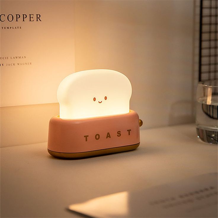 a toast shaped light sitting on top of a table