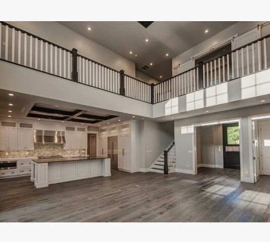 a large open floor plan with wood floors