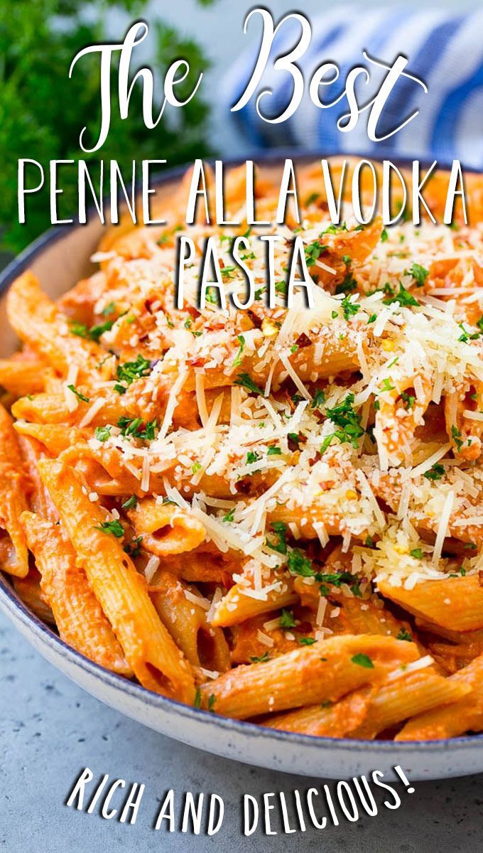 the best penne alla vodka pasta with parmesan cheese and parsley on top