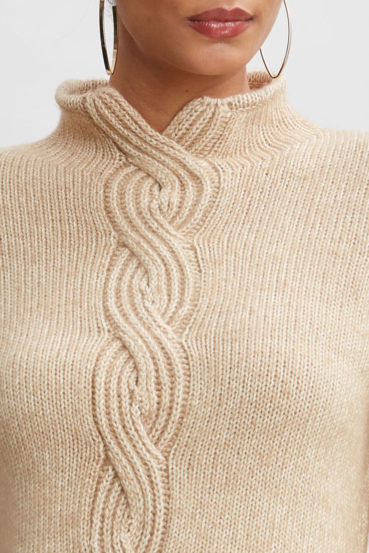 A twist on a classic. The intricate cables of this sweater weave together luxe Italian Melange merino wool and ultra-soft cotton. The cable knit detail & mock neck adds a designer twist to this modern, sporty sweater. Elie Tahari Exclusive Cable Front Sweater 74% Cotton, 26% Merino Runs true to Size Model is 5'9" and wearing size XS Dry Clean Only Imported Style #: E95X6514 Elegant Cable Knit Turtleneck Sweater, Fitted Cable Knit Sweater With Funnel Neck, Merino Wool Cable Knit Sweater With Funnel Neck, Merino Wool Cable Knit Funnel Neck Sweater, Sporty Sweater, Vest Knitting, Merino Sweater, Front Sweater, Cable Sweater