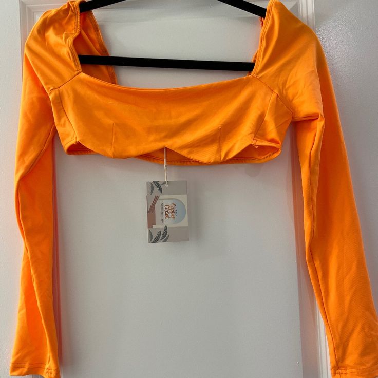 -Bright Orange Top -Never Worn -Stretchy Material -Good For Costumes Or Parties Spring Orange Stretch Tops, Trendy Orange Crop Top For Fall, Orange Fitted Crop Top For Spring, Fitted Orange Crop Top For Spring, Vibrant Orange Fitted Top, Trendy Stretch Orange Crop Top, Trendy Orange Crop Top For Spring, Vibrant Fitted Cotton Top, Vibrant Fitted Spring Tops