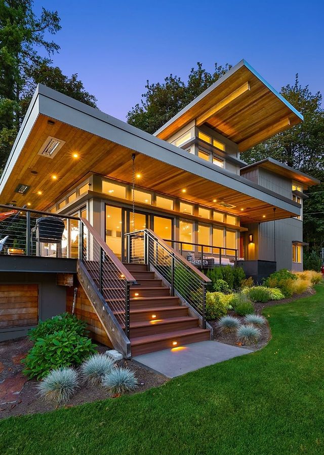 a modern house with stairs leading up to it