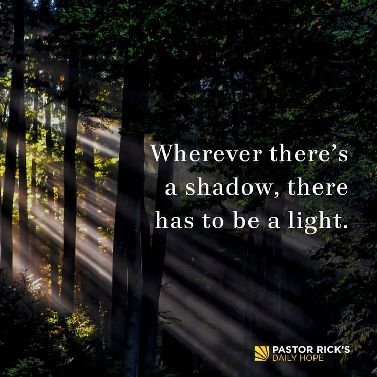 sunlight shining through the trees in a forest with a quote about where there's a shadow, there has to be a light