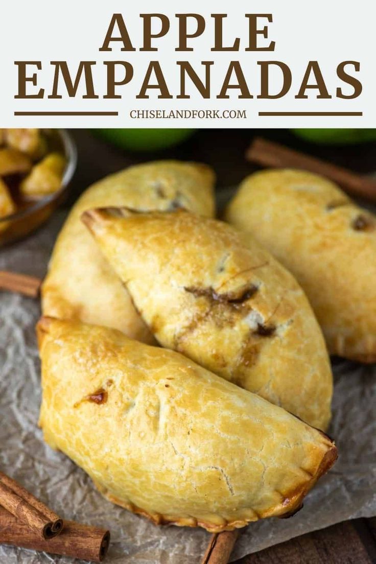 apple empanadas with cinnamon sticks on the side and apples in the background