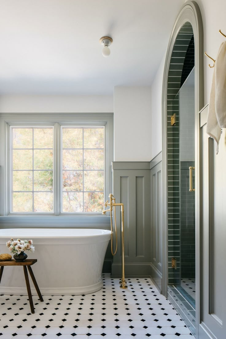 a white bath tub sitting next to a window