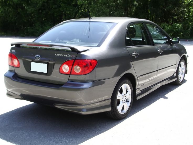 a car that is sitting in the street with a rental sign on it's back