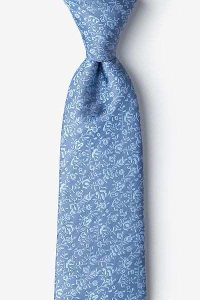 a blue tie with white flowers on it