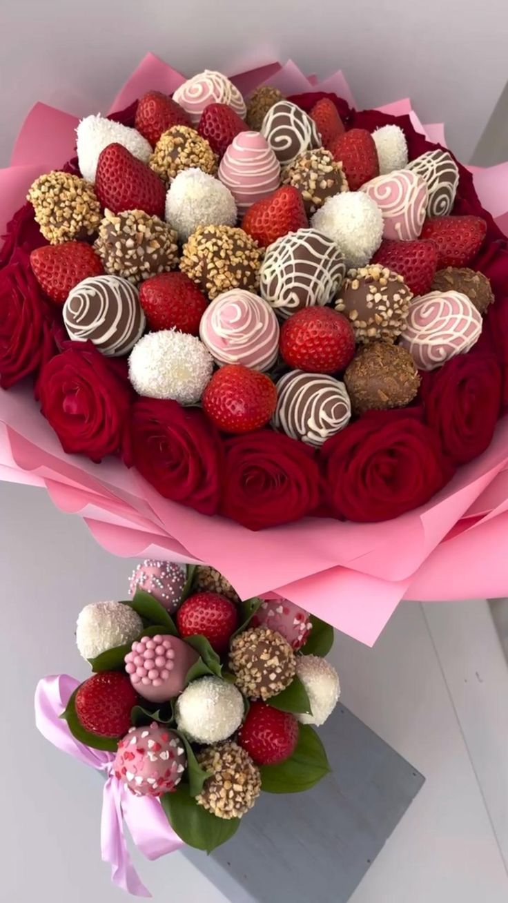 two large bouquets of chocolate covered strawberries and roses