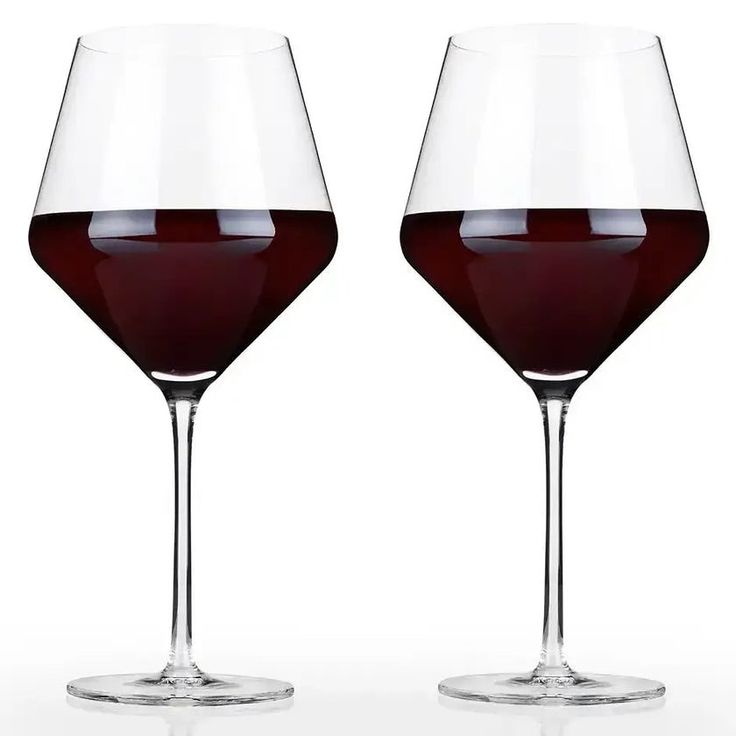 two wine glasses filled with red liquid