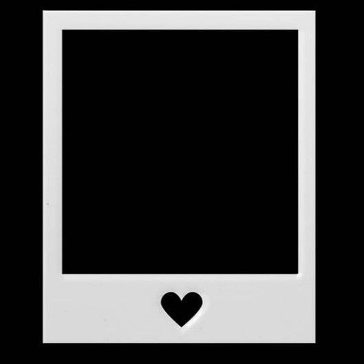 a black and white photo frame with a heart cut out on the front, against a black background