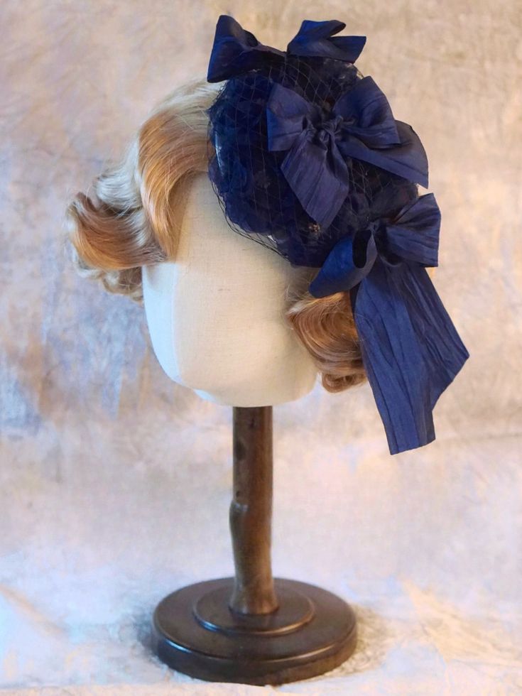 Handmade Dark Blue Bowknot Veil Mini Hat Adjustable Mini Hats With Bow For Kentucky Derby, Blue Adjustable Costume Hats With Short Brim, Blue Adjustable Cap-style Costume Hats, Adjustable Blue Cap Costume Hats And Headpieces, Blue Headband Hat For Kentucky Derby, Adjustable Mini Hats With Bow On Headband, Blue Adjustable Headband Fascinator, Adjustable Blue Headband Fascinator, Adjustable Bow Headpiece For Kentucky Derby