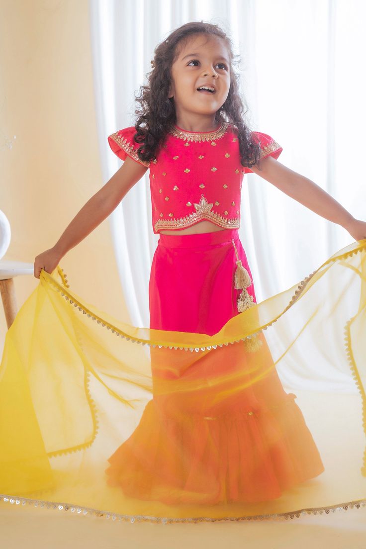 Fuchsia pink lehenga with tiered frill hem. Paired with floral, sequin embroidered blouse and dupatta.
Component: 3
Pattern: Embroidery
Type Of Work: Floral, sequin
Neckline: Round
Sleeve Type: Cap sleeves
Fabric: Roman Silk, Lining: Cotton
Color: Fuchsia,Pink
Other Details: 
Sheer dupatta
Occasion: Festive and Wedding - Aza Fashions Sheer Dupatta, Floral Lehenga, Pink Lehenga, Embroidery Floral, Color Fuchsia, Pattern Embroidery, Girl Online, Silk Embroidery, Fashion App