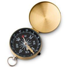 a brass compass with keychain is shown on a white background for use as a pocket watch